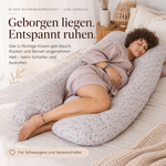 Schwangere beim Seitenschlafen im grauen U-förmigen Schwangerschaftskissen – angenehme Unterstützung für Bauch, Rücken und Beine